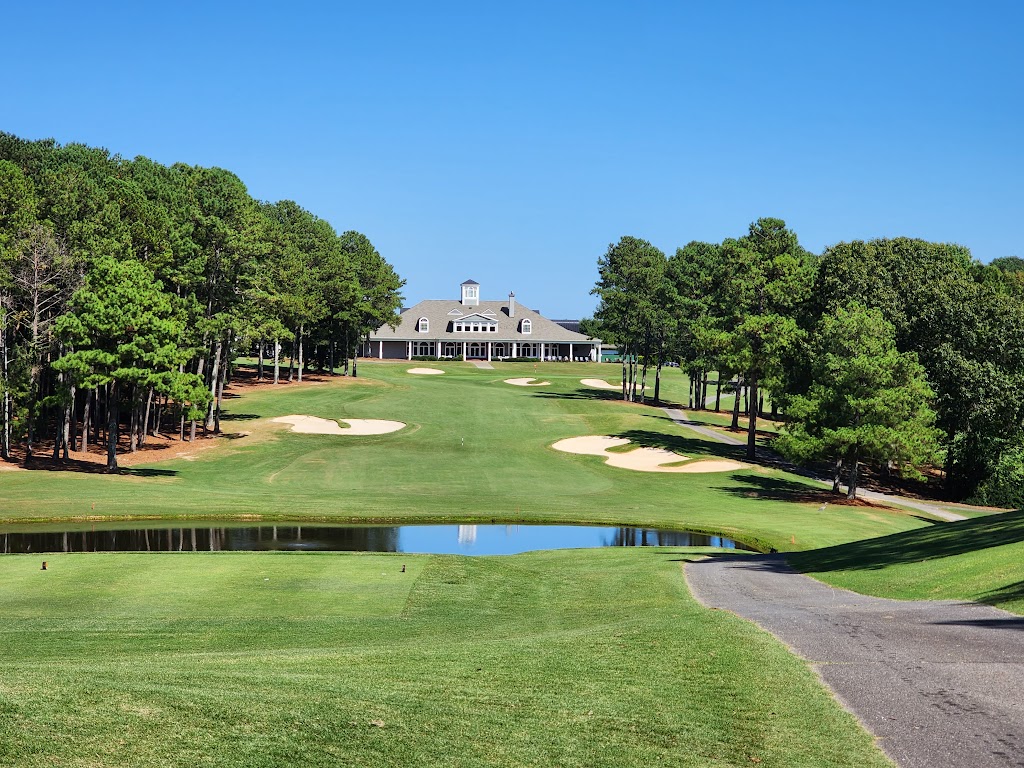 Panoramic view of a lush green golf course at The Chateau Elan Golf Club. Smooth