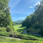 Panoramic view of a lush green golf course at The Cliffs Valley - Golf Course & Clubhouse. Smooth