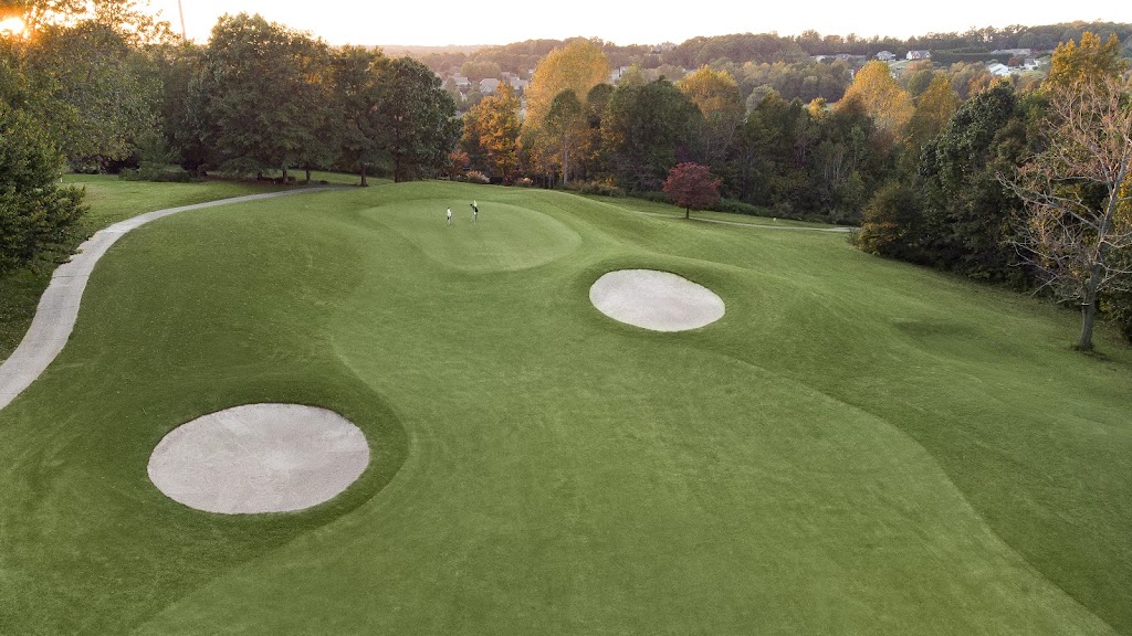 Panoramic view of a lush green golf course at The Club At Brookstone. Smooth