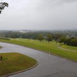Panoramic view of a lush green golf course at The Club at Five Oaks. Smooth