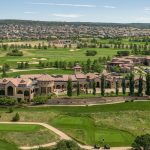 Panoramic view of a lush green golf course at The Club at Flying Horse. Smooth