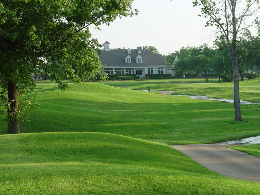 Panoramic view of a lush green golf course at The Club at Forest Ridge. Smooth