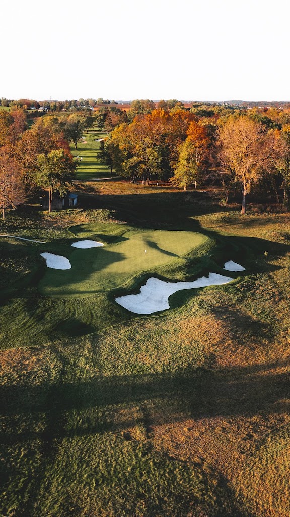 Panoramic view of a lush green golf course at The Club at Lac La Belle. Smooth