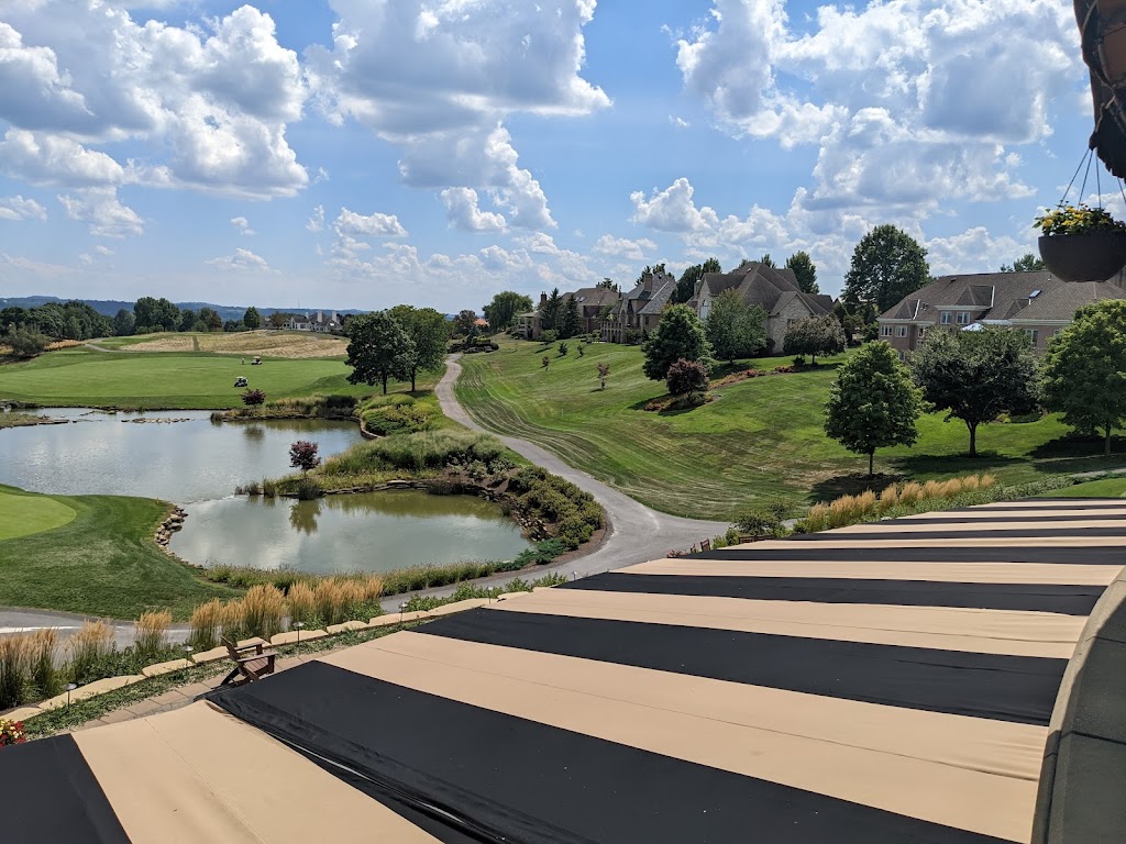 Panoramic view of a lush green golf course at The Club at Nevillewood. Smooth
