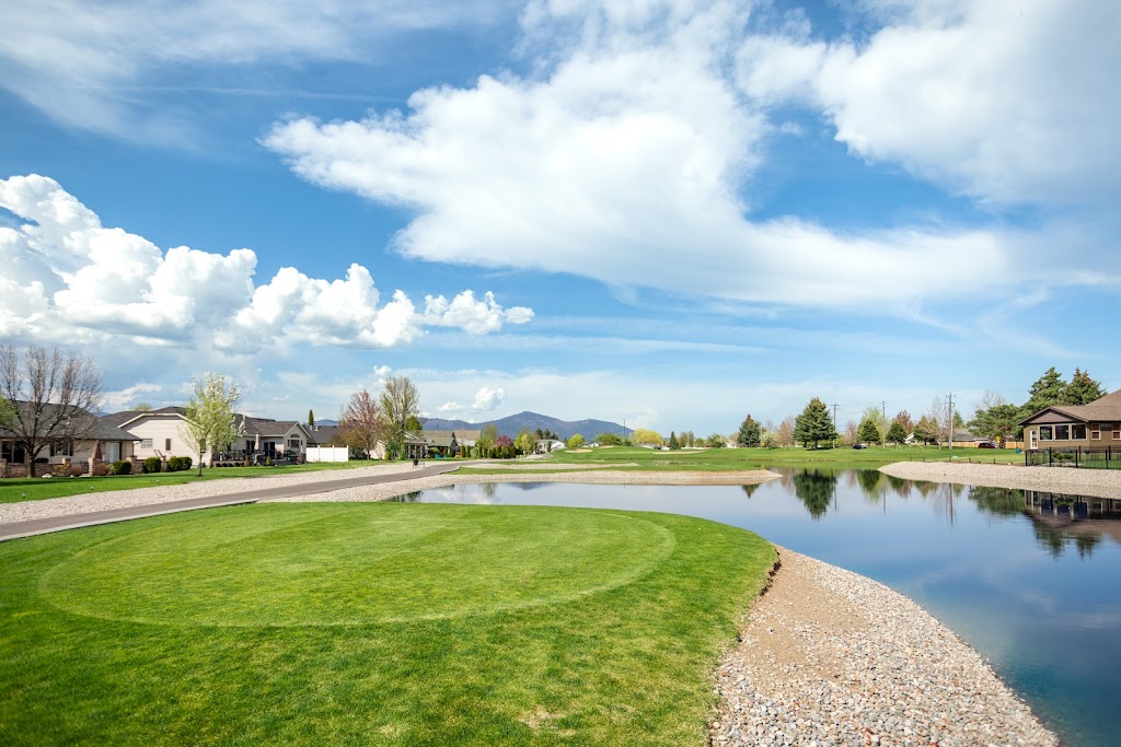Panoramic view of a lush green golf course at The Club at Prairie Falls. Smooth