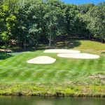 green grass with the flag in the hole.
