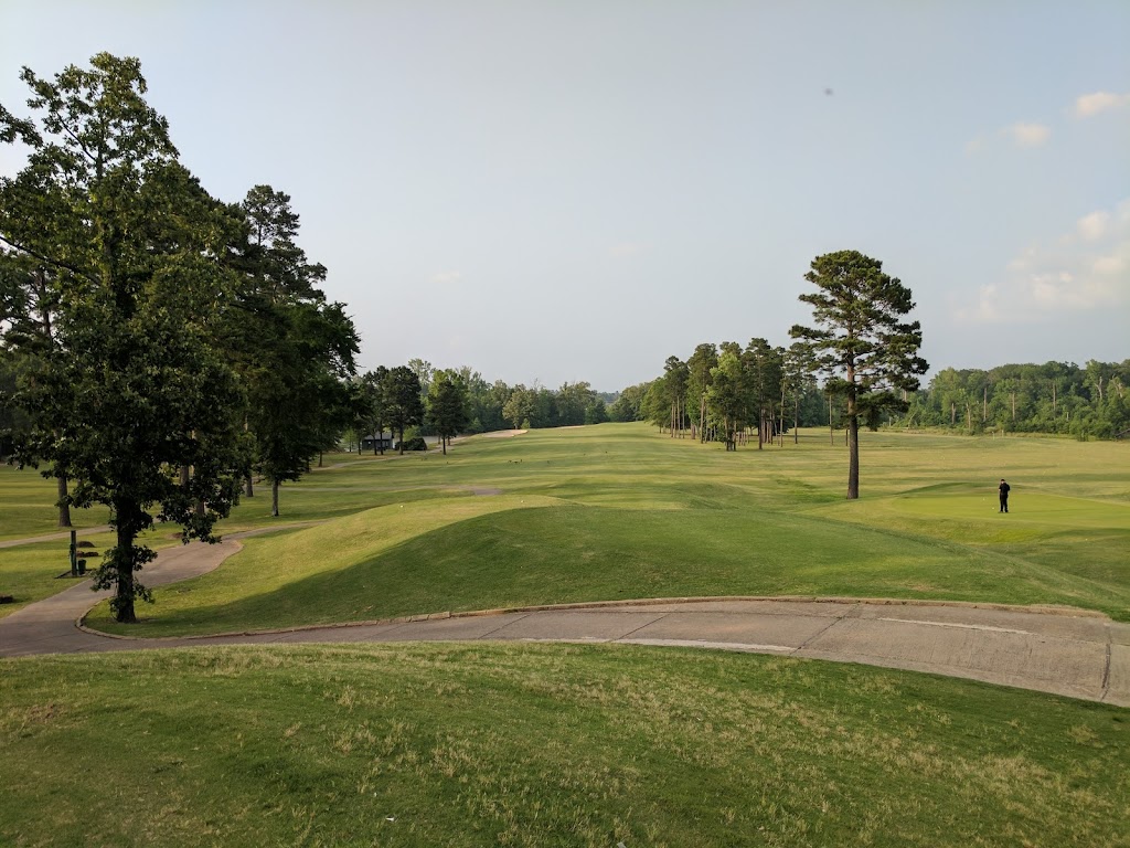 Panoramic view of a lush green golf course at The Country Club of Arkansas. Smooth
