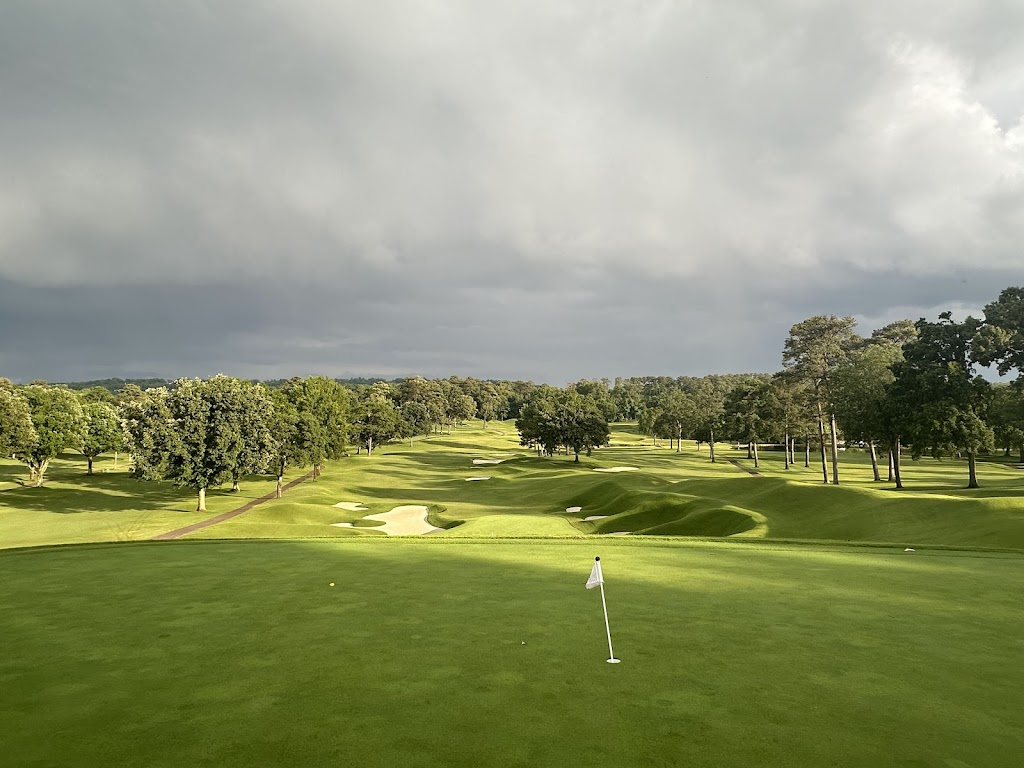 Panoramic view of a lush green golf course at The Country Club of Birmingham. Smooth