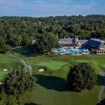 Panoramic view of a lush green golf course at The Country Club of Birmingham. Smooth
