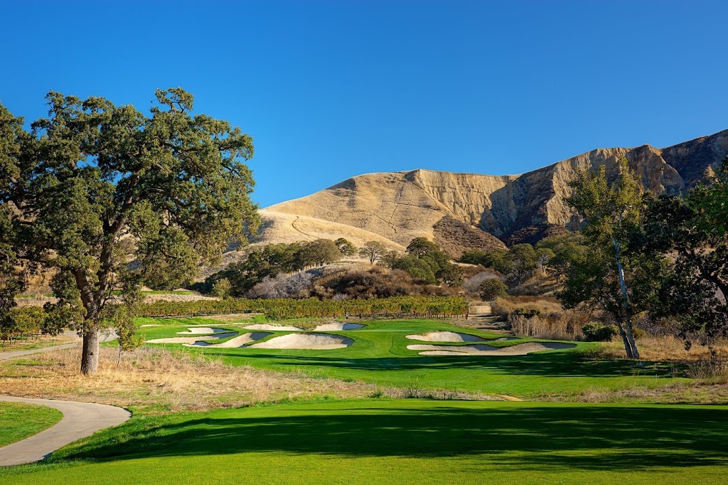 Panoramic view of a lush green golf course at The Course at Wente Vineyards. Smooth