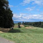 Panoramic view of a lush green golf course at The Creek. Smooth