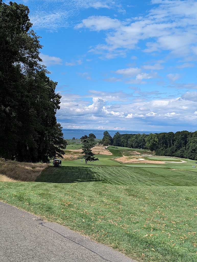 Panoramic view of a lush green golf course at The Creek. Smooth