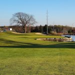 Panoramic view of a lush green golf course at The Crown Golf Club. Smooth