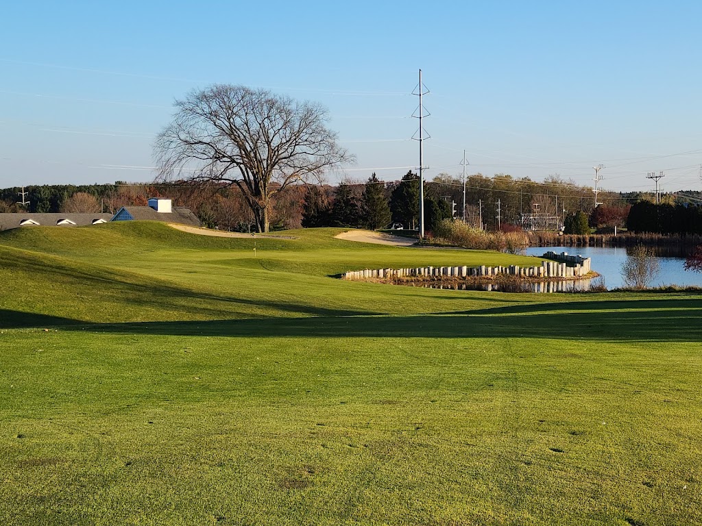 Panoramic view of a lush green golf course at The Crown Golf Club. Smooth