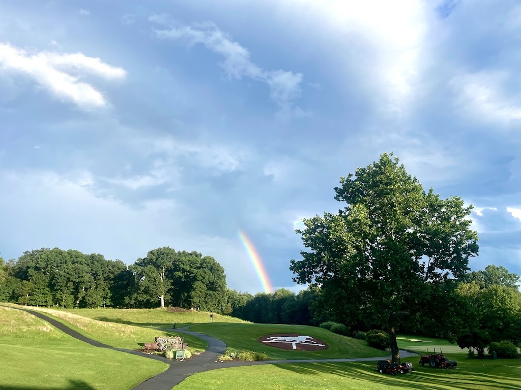 Panoramic view of a lush green golf course at The Farms Country Club. Smooth