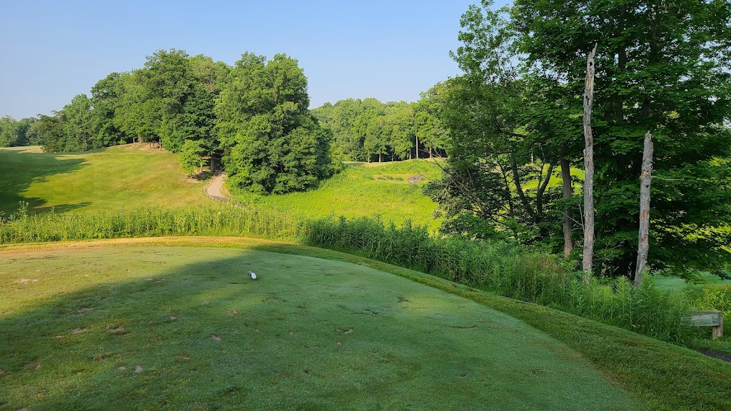 Panoramic view of a lush green golf course at The Fort Golf Resort. Smooth