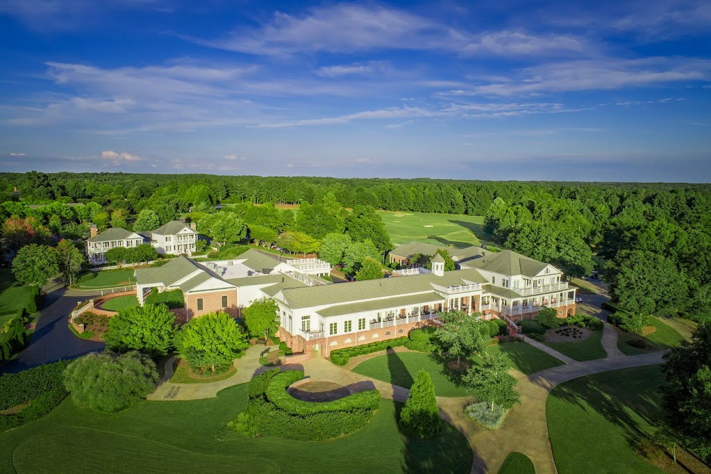 Panoramic view of a lush green golf course at The Georgia Club. Smooth