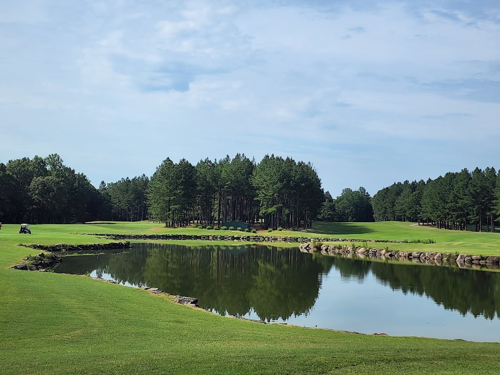Panoramic view of a lush green golf course at The Golf Club at Mattaponi Springs. Smooth