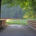 Panoramic view of a lush green golf course at The Golf Club at South River. Smooth