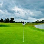 Panoramic view of a lush green golf course at The Golf Club at Stonelick Hills. Smooth