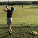 green grass with the flag in the hole.