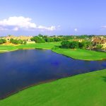 Panoramic view of a lush green golf course at The Golf Club of Edmond. Smooth