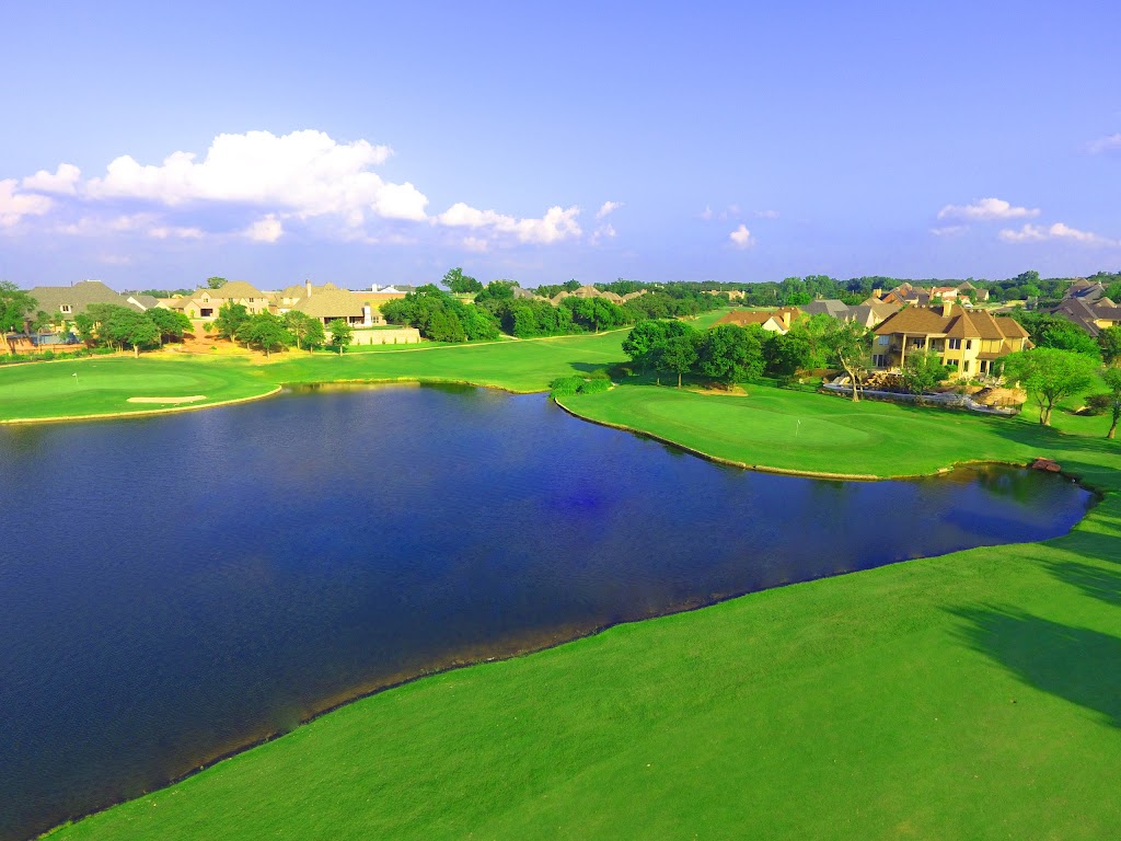 Panoramic view of a lush green golf course at The Golf Club of Edmond. Smooth