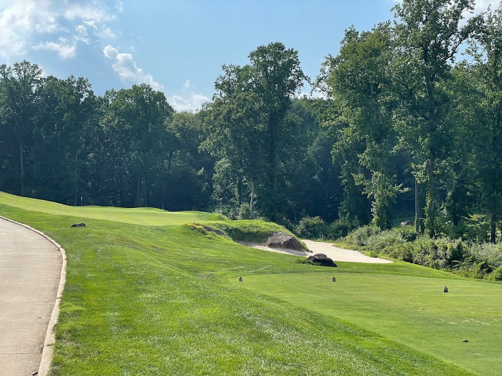 Panoramic view of a lush green golf course at The Golf Course at Glen Mills. Smooth