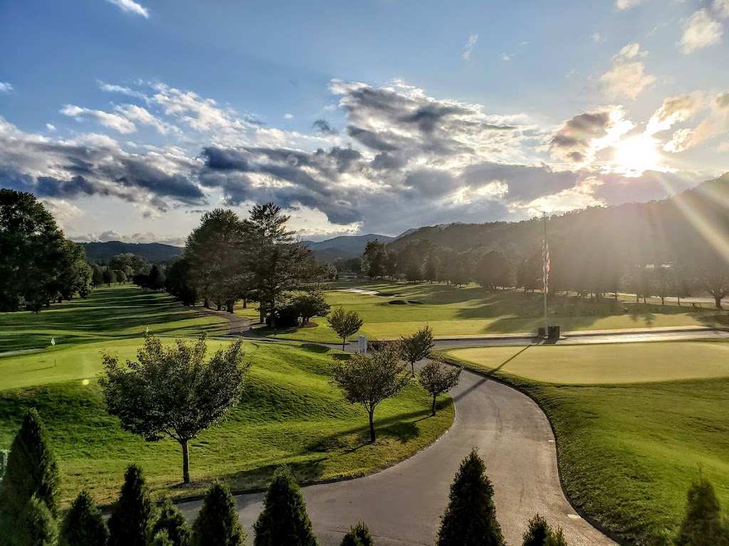 Panoramic view of a lush green golf course at The Greenbrier Golf Club. Smooth