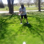 green grass with the flag in the hole.