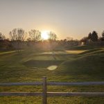 Panoramic view of a lush green golf course at The Greg Mastriona Golf Courses at Hyland Hills. Smooth