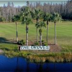 Panoramic view of a lush green golf course at The Groves Golf and Country Club. Smooth