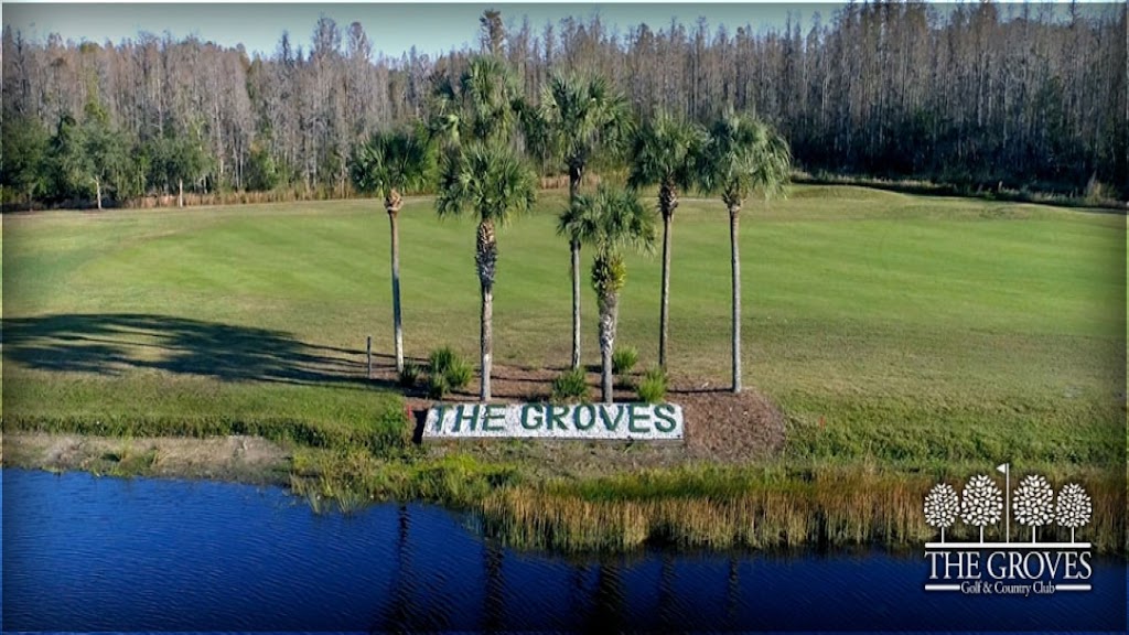 Panoramic view of a lush green golf course at The Groves Golf and Country Club. Smooth