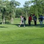 green grass with the flag in the hole.