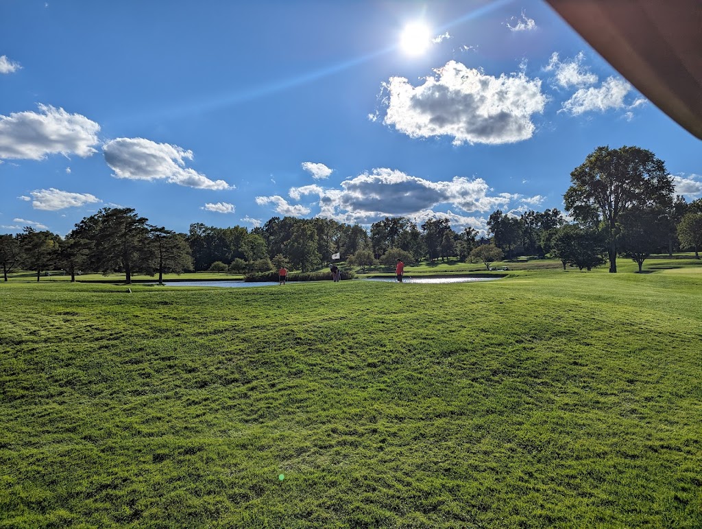 Panoramic view of a lush green golf course at The Hartford Golf Club. Smooth