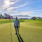 green grass with the flag in the hole.