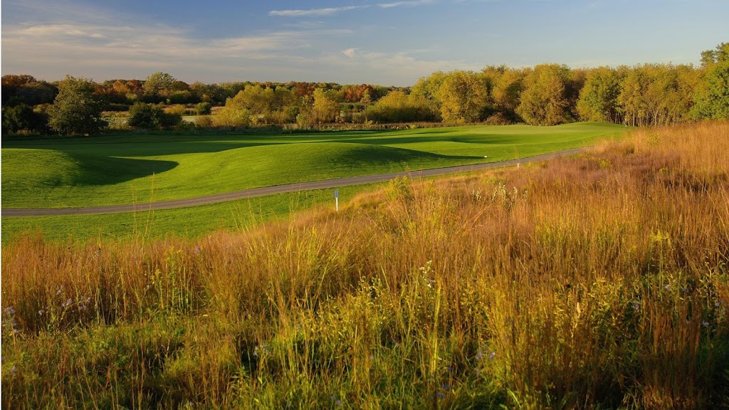 Panoramic view of a lush green golf course at The Highlands Golf Course at Grand Geneva. Smooth