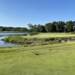 Panoramic view of a lush green golf course at The Honors Course. Smooth