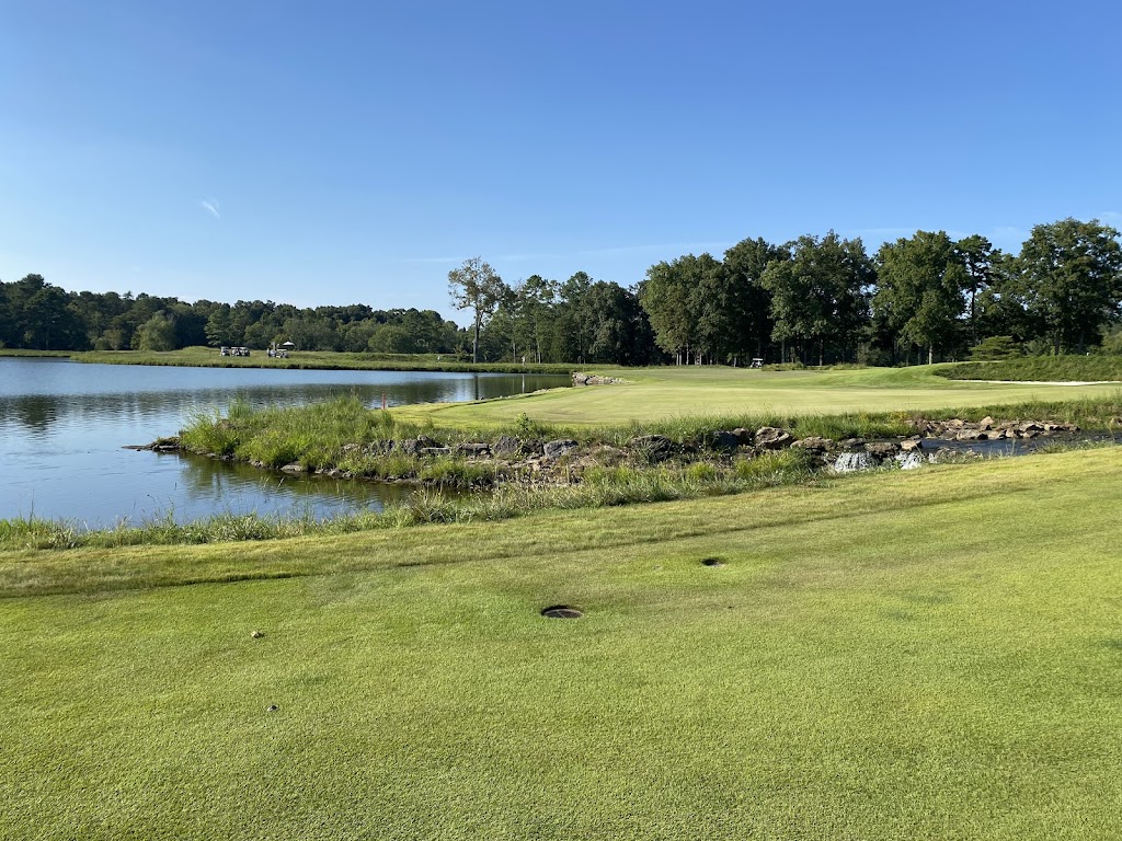 Panoramic view of a lush green golf course at The Honors Course. Smooth
