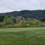 Panoramic view of a lush green golf course at The Jewel Golf Club. Smooth