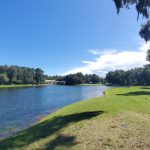 Panoramic view of a lush green golf course at The King and Prince Golf Club. Smooth