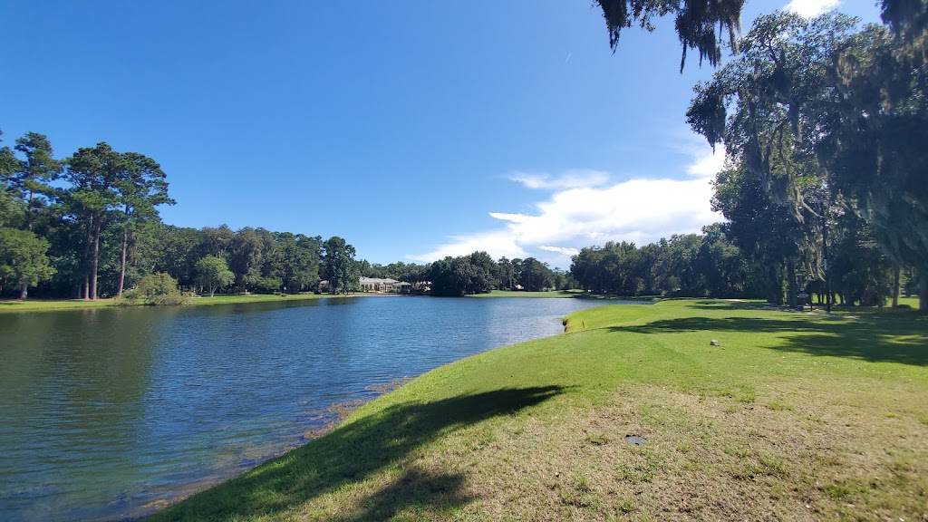 Panoramic view of a lush green golf course at The King and Prince Golf Club. Smooth