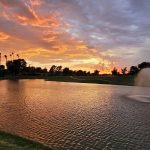 Panoramic view of a lush green golf course at The Lakes Course at Westbrook Village Golf Club. Smooth