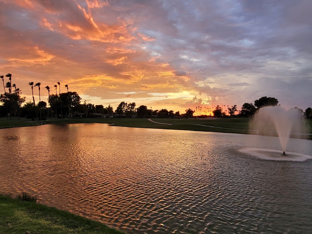 Panoramic view of a lush green golf course at The Lakes Course at Westbrook Village Golf Club. Smooth