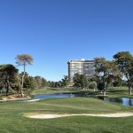 Panoramic view of a lush green golf course at The Las Vegas Country Club. Smooth