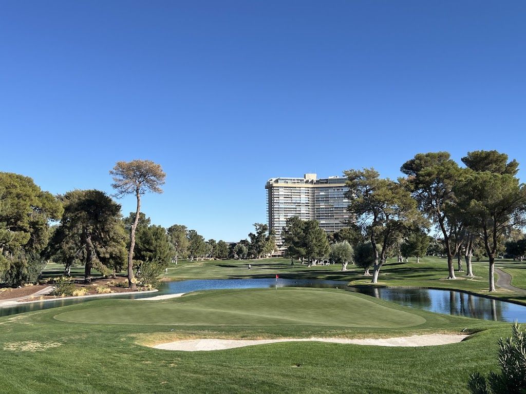 Panoramic view of a lush green golf course at The Las Vegas Country Club. Smooth