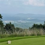 Panoramic view of a lush green golf course at The Ledges. Smooth