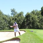 green grass with the flag in the hole.