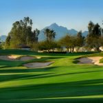 Panoramic view of a lush green golf course at The Legacy Golf Club. Smooth