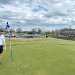 green grass with the flag in the hole.